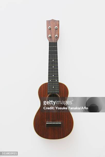 wooden ukulele - ukulele stock-fotos und bilder