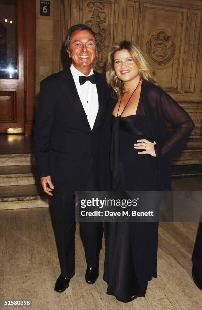 Presenter Des O'Connor and partner Jodie Brooke Wilson arrive at the "10th Anniversary National Television Awards" at the Royal Albert Hall on...