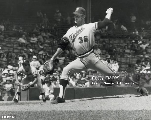 American professional baseball player pitcher Jim Kaat of the Minnesota Twins, on the way to his shutout, pitches to Thurman Munson of the New York...