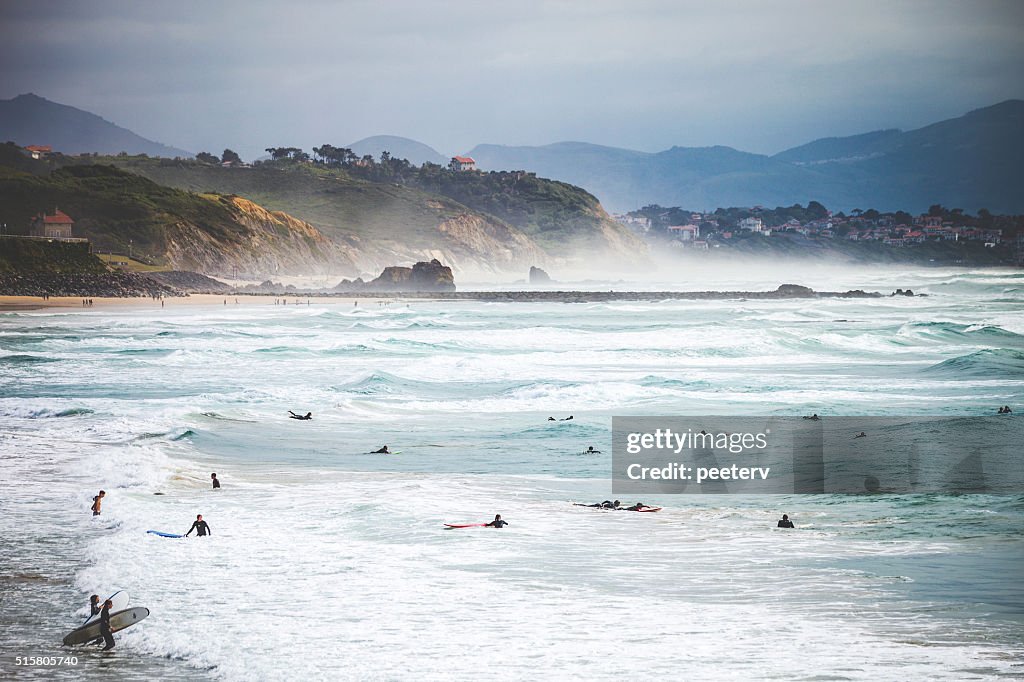 Surfers at the beach. Biarritz, France.