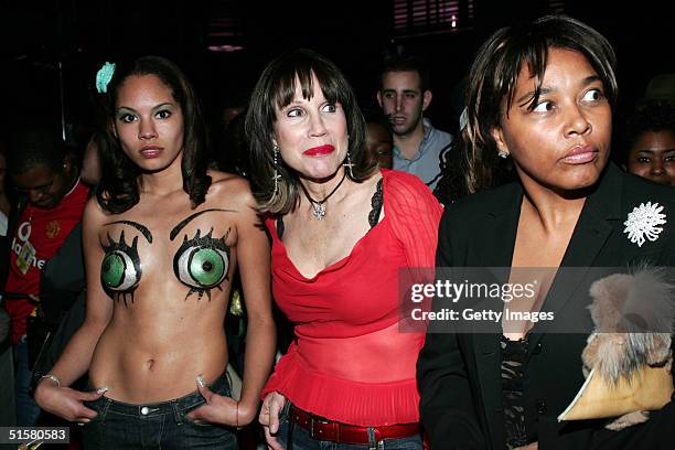 Celia Johnson watches a runway show at Wyclef Jean's birthday party presented by sponsor Miami Boutique Hotels October 26, 2004 in New York City.