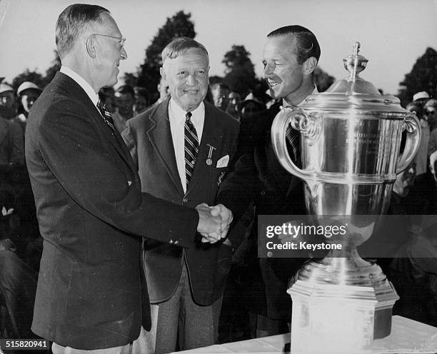 America beat Britain in the Walker Cup Golf Competition: US Team captain Francis Ouimet, USGA President Fielding Wallace and British caption Laddie...