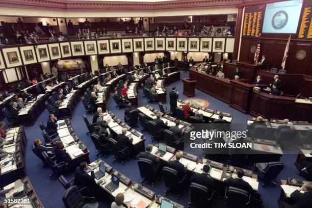 The 120 members of the Florida State House of Representatives attend a special session 12 December, 2000 aimed at drafting a resolution that would go...
