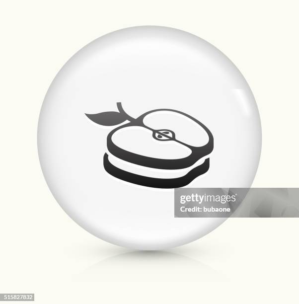 sliced apples icon on white round vector button - apple half stock illustrations