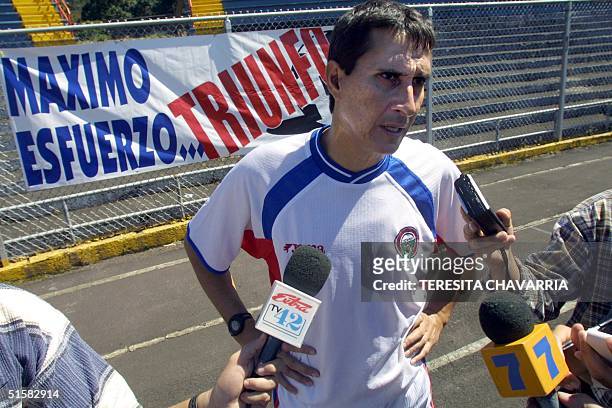 The coach of Costa Rican soccer selection Alexander Guimaraes speaks to the press 21 December 2000, after the training at the National Stadium in San...