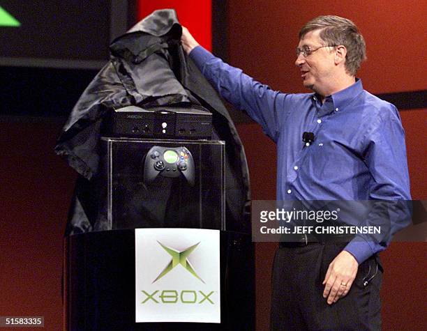 Bill Gates, chairman and chief software architect of Microsoft, unveils the new Xbox video game console during his keynote address at the Consumer...