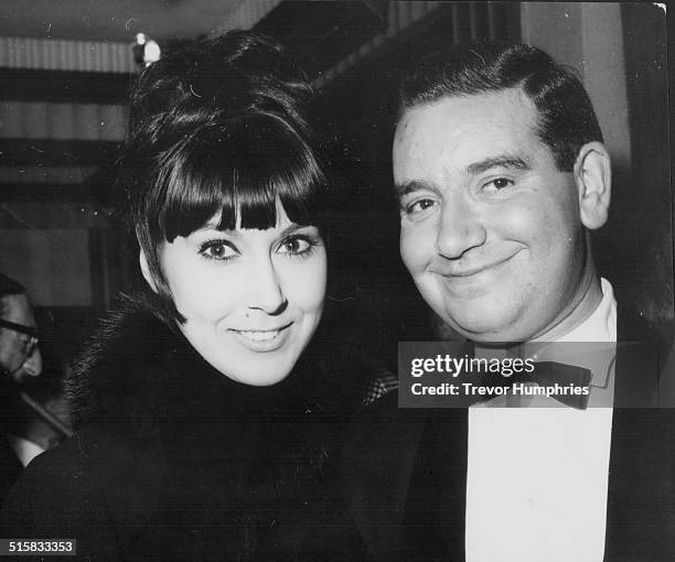 Comedian Dennis Goodwin and singer Anita Harris arriving at the London Pavilion, for the premiere of the film 'Topkapi', London, November 13th 1964.