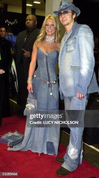 Pop star Britney Spears and her boyfriend, singer Justin Timberlake of the group NSYNC arrive backstage at the 28th Annual American Music Awards 08...