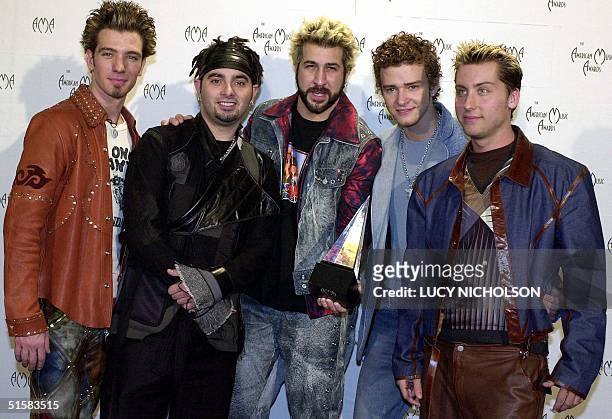 Chasez, Chris Kirkpatrick, Joey Fatone, Justin Timberlake, Lance Bass of the group 'N Sync, pose with their award for Internet Artist of the Year at...