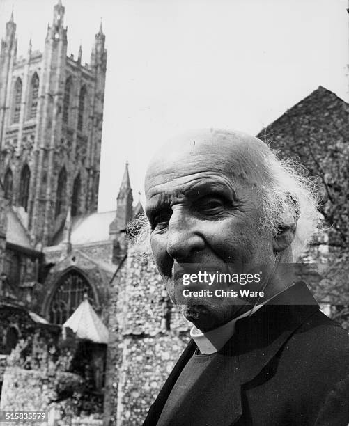 Reverend Dr Hewlett Johnson, Dean of Canterbury Cathedral, strolling around the grounds of the Cathedral, circa 1963.