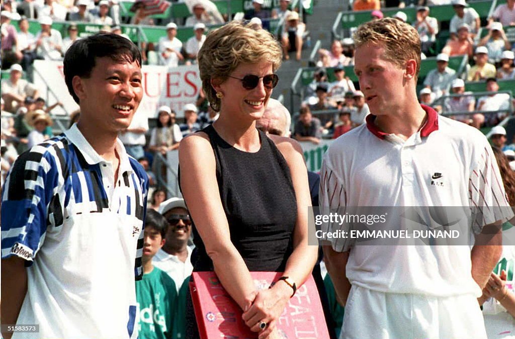 Britain's Princess Diana stands with tennis player