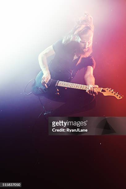 electric guitarist playing concert - heavy metal guitarist stock pictures, royalty-free photos & images