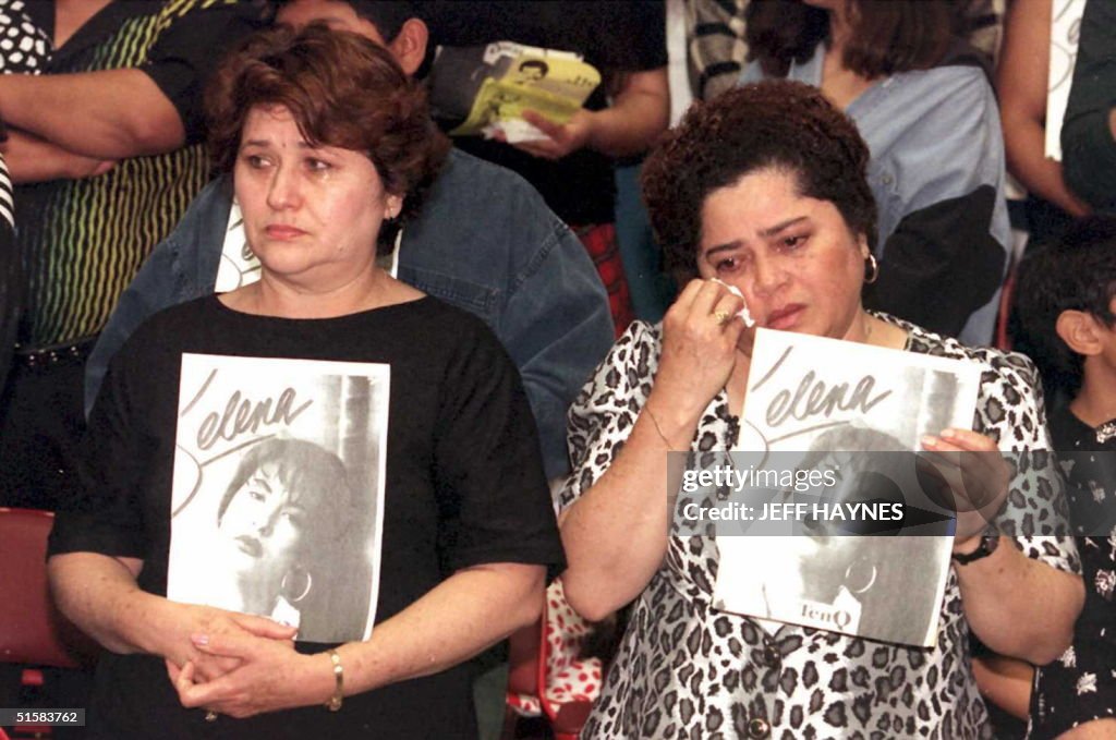 Estella Leak(R) wipes away tears during a memorial
