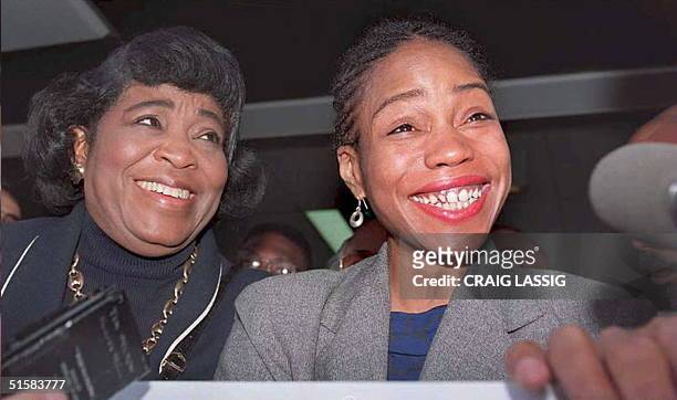 Quibilah Shabazz, daughter of Malcolm X, smiles at a new conference 01 May after it was announced that she had reached an out of court settlement...
