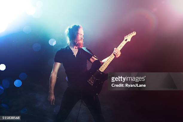 electric guitarist playing concert - heavy metal stock pictures, royalty-free photos & images