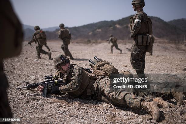 In a photo taken on March 15, 2016 US soldiers of the 31st Marine Expeditionary Unit infantry take part in a live fire drill during an exercise...