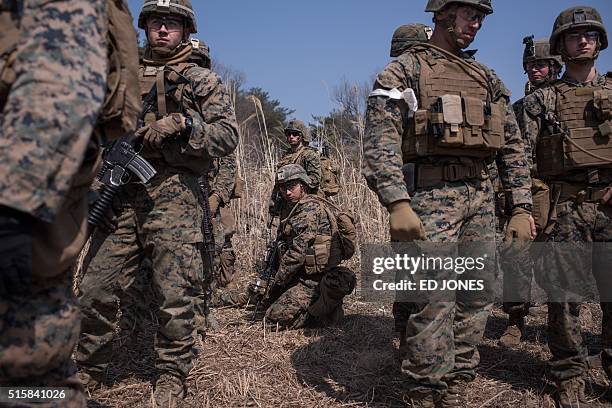 In a photo taken on March 15, 2016 US soldiers of the 31st Marine Expeditionary Unit infantry take part in a live fire drill during an exercise...