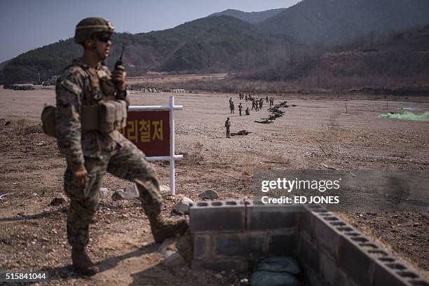 In a photo taken on March 15, 2016 US soldiers of the 31st Marine Expeditionary Unit infantry take part in a live fire drill during an exercise...