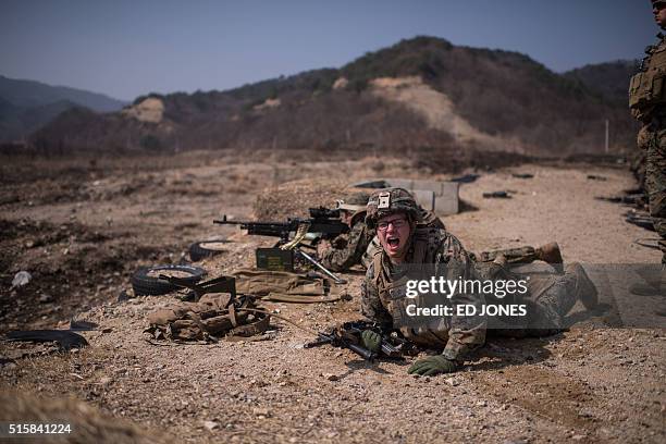 In a photo taken on March 15, 2016 US soldiers of the 31st Marine Expeditionary Unit infantry take part in a live fire drill during an exercise...