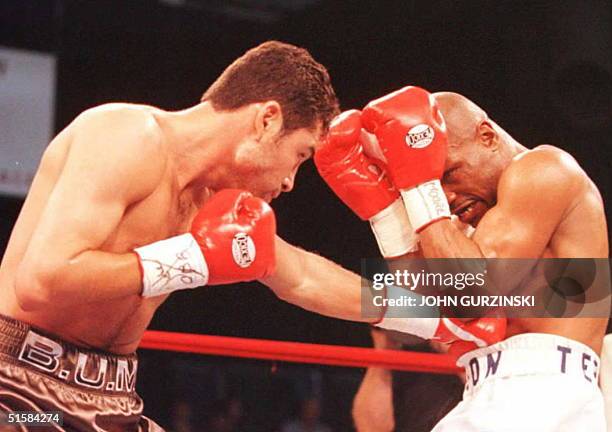 Oscar De La Hoya lands a left to Darryl Tyson's stomach in the second round of their scheduled 12 round fight at Caesars Palace Hotel in Las Vegas....