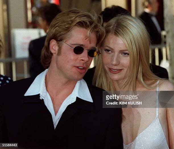 Actor Brad Pitt , nominee for best supporting actor for his role as " Jeffrey Goines" in "12 Monkeys" and his companion Gwyneph Paltrow arrives at...