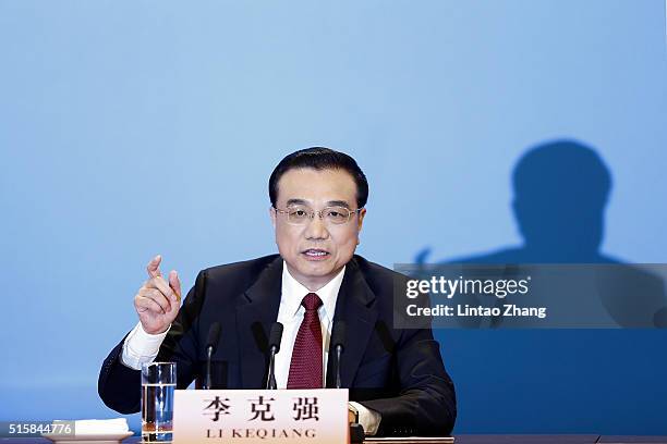 China's Premier Li Keqiang answers questions during the annual news conference following the closing session of the National People's Congress at the...