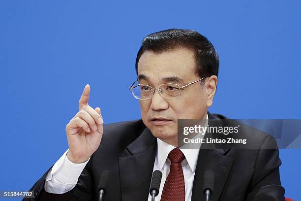 China's Premier Li Keqiang answers questions during the annual news conference following the closing session of the National People's Congress at the...