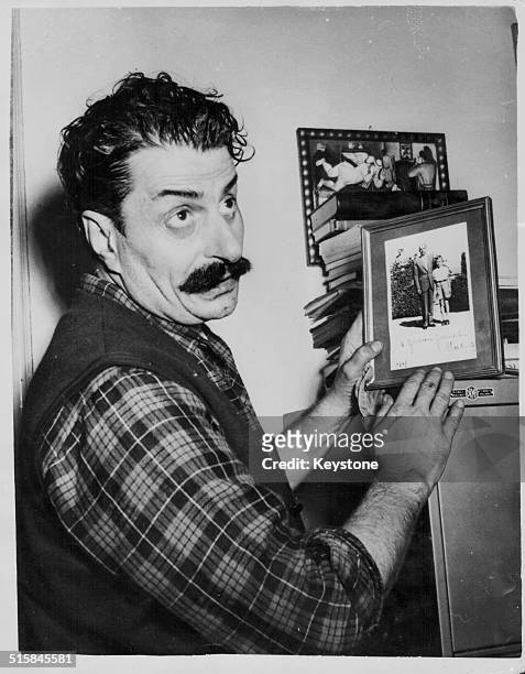 Italian cartoonist Giovanni Guareschi in his office, being sued by ex-Prime Minister Alcide de Gasperi for slander, January 26th 1954.