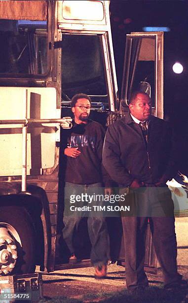 Director Spike Lee and actor Charles Dutton exit a bus being used as a set for Lee's low-budget movie about last year's Million Man March called,...