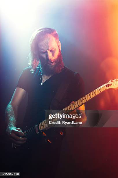 electric guitarist playing concert - heavy metal guitarist stock pictures, royalty-free photos & images