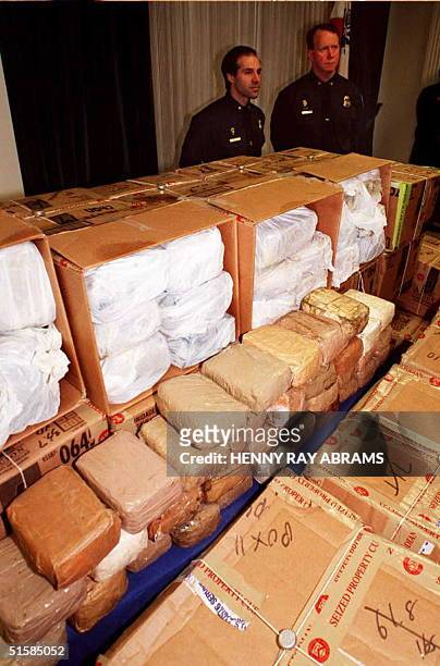 Customs Agents stand guard, 16 April in New York, over some 2,000 pounds of cocaine seized in February at Newark and Port Elizabeth New Jersey in two...