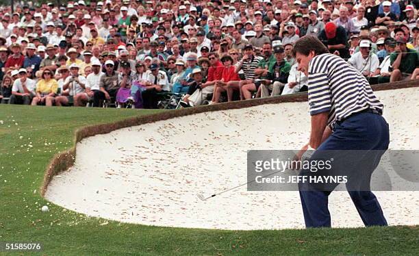 Nick Faldo of England hits out of the sand trap on the seventh hole 13 April during third round action of The Masters at Augusta National Golf Club...