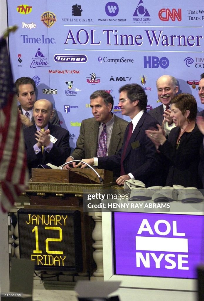 AOL Time Warner CEO Gerald Levin (2nd L) and AOL T