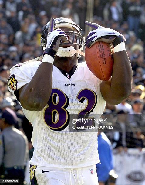 Shannon Sharpe of the Baltimore Ravens celebrates his 96-yard touchdown reception against the Oakland Raiders in the second quarter of their AFC...