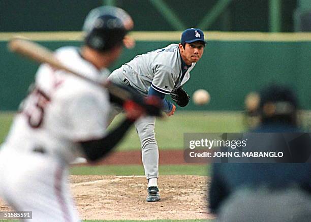 Los Angeles Dodgers pitcher Hideo Nomo of Japan throws a pitch to strike-out San Francisco Giants batter Rich Aurillia 18 July in San Francisco. Nomo...
