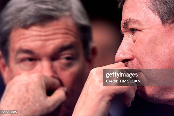 Attorney General-designate John D. Ashcroft joined by Senator Christopher Bond waits to testify during his US Senate confirmation hearing in the Hart...