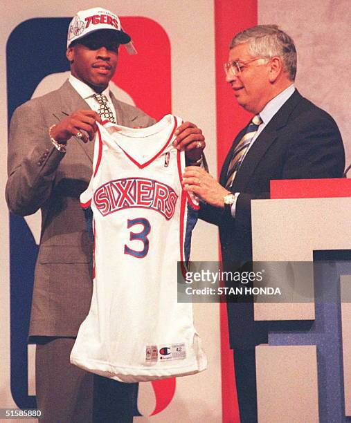 Allen Iverson holds Philadelphia 76ers' jersey with NBA commissioner David Stern after being the first pick in the NBA draft 26 June at the...