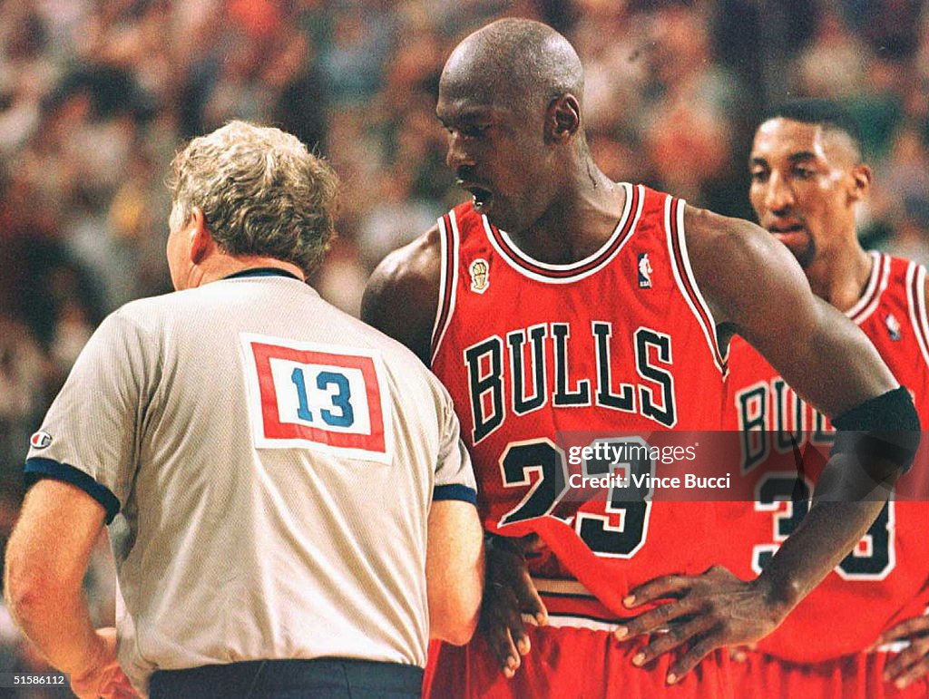 Michael Jordan (C) of the Chicago Bulls yells at o