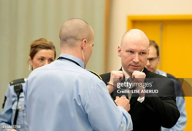 Norwegian mass killer Anders Behring Breivik has his handcuffs removed inside the court room in Skien prison, March 16, 2016. Behring Breivik is...