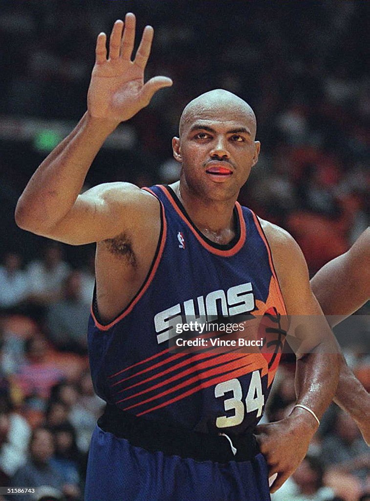 Charles Barkley of the Phoenix Suns waves to fans