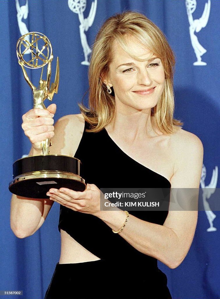 Actress Helen Hunt holds the Emmy she won for outs