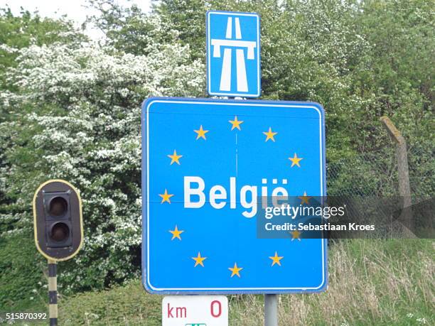 border sign "belgië" belgium, along highway - belgium border stock pictures, royalty-free photos & images