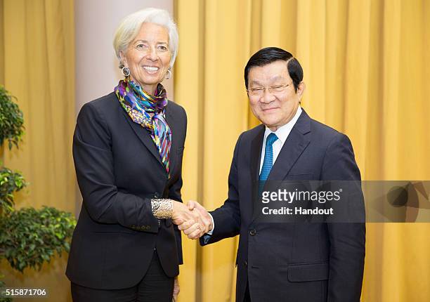 In this handout photo provided by the International Monetary Fund , International Monetary Fund Managing Director Christine Lagarde is greeted by...