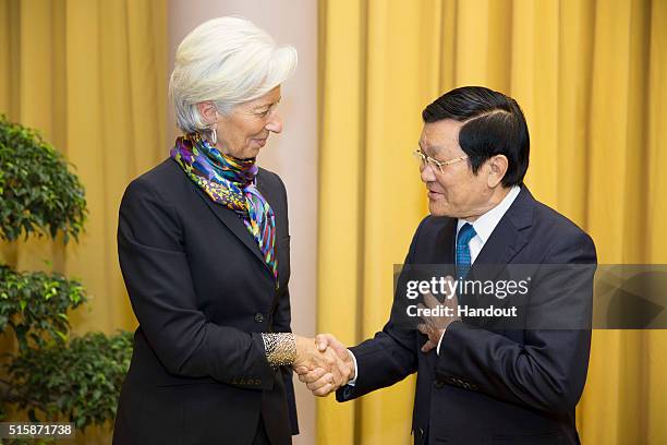 In this handout photo provided by the International Monetary Fund , International Monetary Fund Managing Director Christine Lagarde is greeted by...