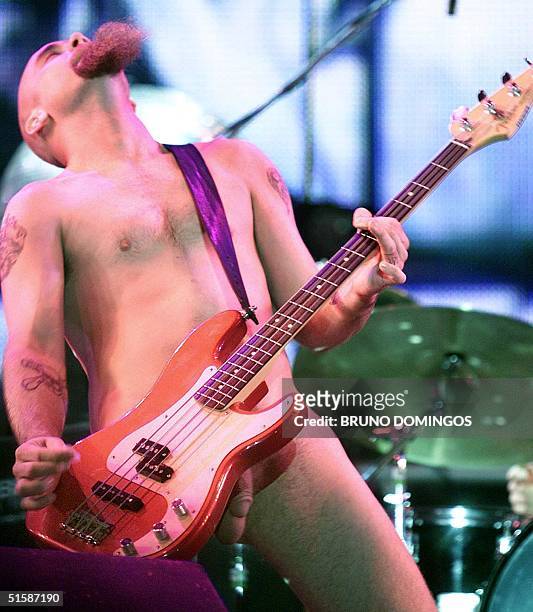 Josh Homme, vocalist of the group Queens of the Stone Age, performs being naked during the concert at the third music festival Rock in Rio, in Rio de...