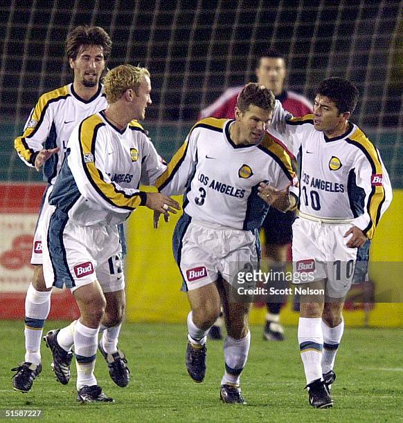 Galaxy defender Greg Varney is congratulated by his teammates after scoring a penalty shot goal in the first half of a 19 January 2001 Champion's Cup...