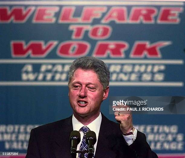 President Bill Clinton clinches his fist during a 27 October speech on welfare reform at Vanderbilt University Medical Center in Nashville,...
