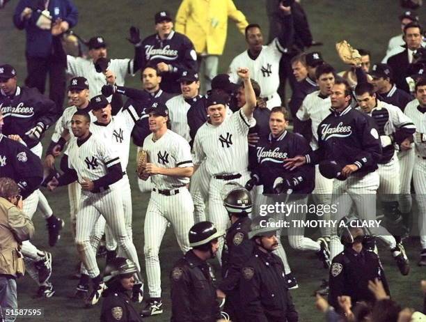 The New York Yankees celebrate 26 October after beating the Atlanta Braves in game six 3-2 to win the World Series at Yankee Stadium in New York. AFP...