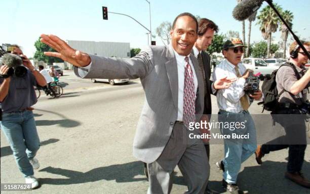 Simpson crosses the street from the courthouse in Santa Monica, California during a lunch break 23 October on the first day of his trial in the...