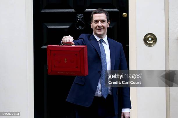 British Chancellor of the Exchequer, George Osborne holds up the Budget Box as he poses for photographs outside 11 Downing Street on March 16, 2016...